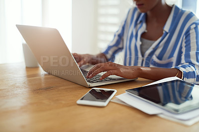 Buy stock photo Laptop, woman and hands typing at desk for blog, social media and email in apartment. African female journalist, technology and work from home for research, newspaper article and online magazine