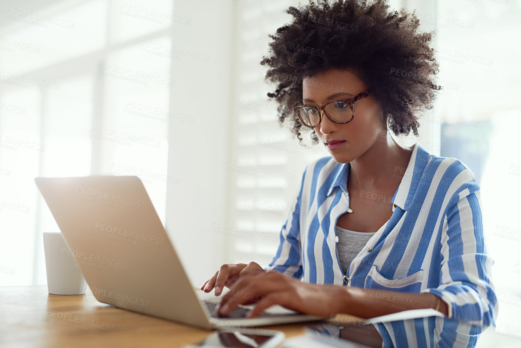 Buy stock photo Black woman, desk and laptop in home with typing for remote work, online business and entrepreneur. African female writer, technology and research by table with book author, website and fiction story