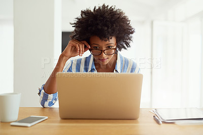 Buy stock photo Woman, research and laptop at desk for blog, social media and networking in apartment. African female journalist, glasses and work from home for reading, newspaper article and online magazine