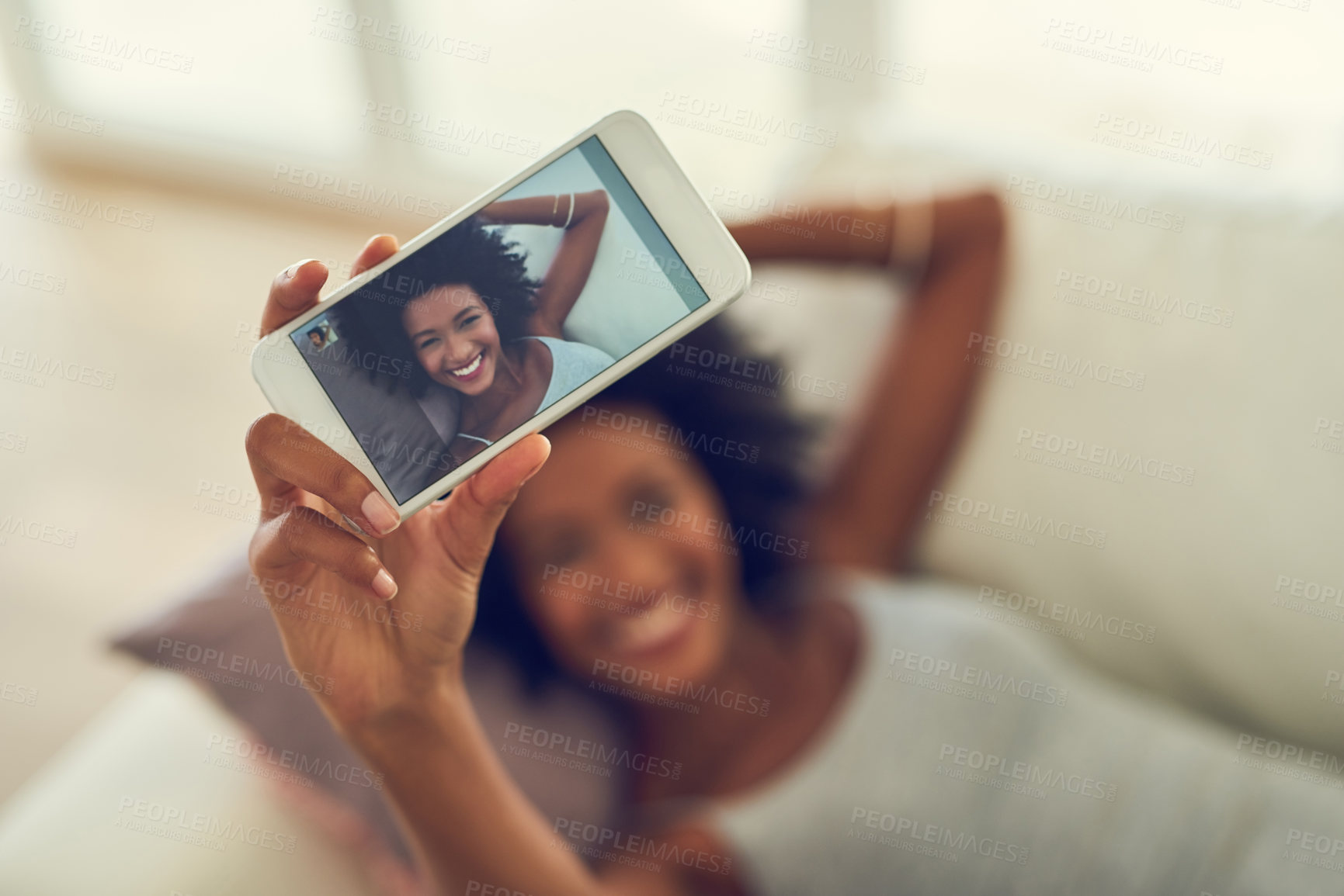 Buy stock photo Cropped shot of a young woman taking a photo of herself