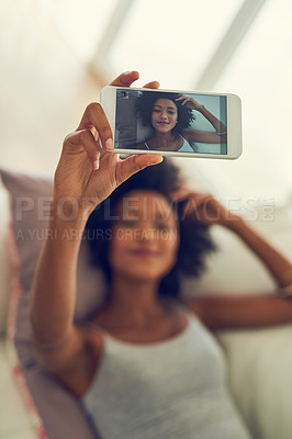 Buy stock photo Woman, display and hand with selfie in home on sofa for profile picture update, social media post and memory. Girl, photography and screen on couch with relax, smile and confidence in living room