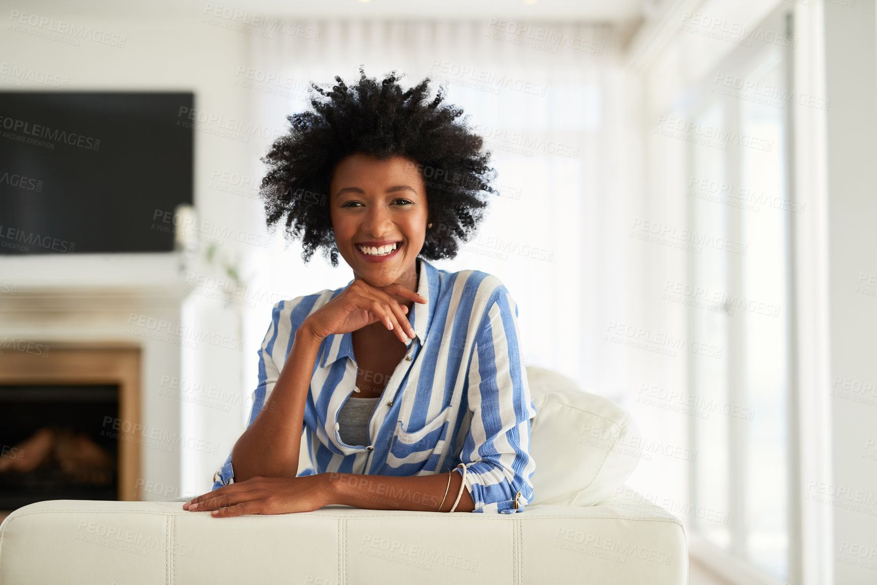 Buy stock photo Portrait, black woman and couch in home for relax, calm or living room on break. Face, smile or rest on sofa in lounge for female person with afro, furniture or peace on weekend for wellness in house