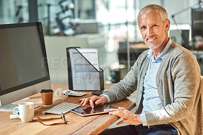 Buy stock photo Portrait of a smiling mature businessman sitting at his desk in an office