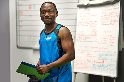 Buy stock photo Portrait of a personal trainer standing in his office at the gym