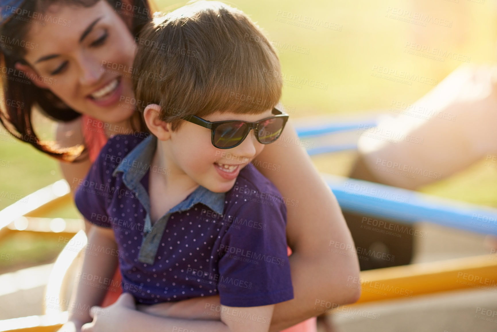 Buy stock photo Cropped shot of a mother and son enjoying a day at the park together
