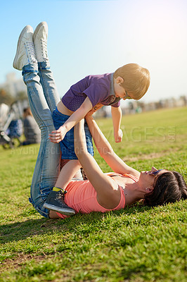 Buy stock photo Shot of a mother and son enjoying a day at the park together