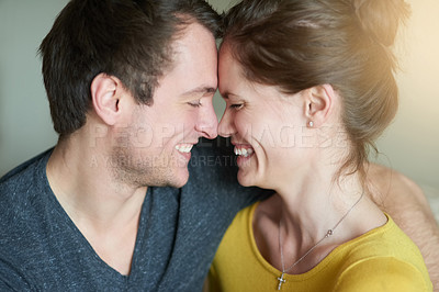 Buy stock photo Shot of a loving couple showing each other affection at home