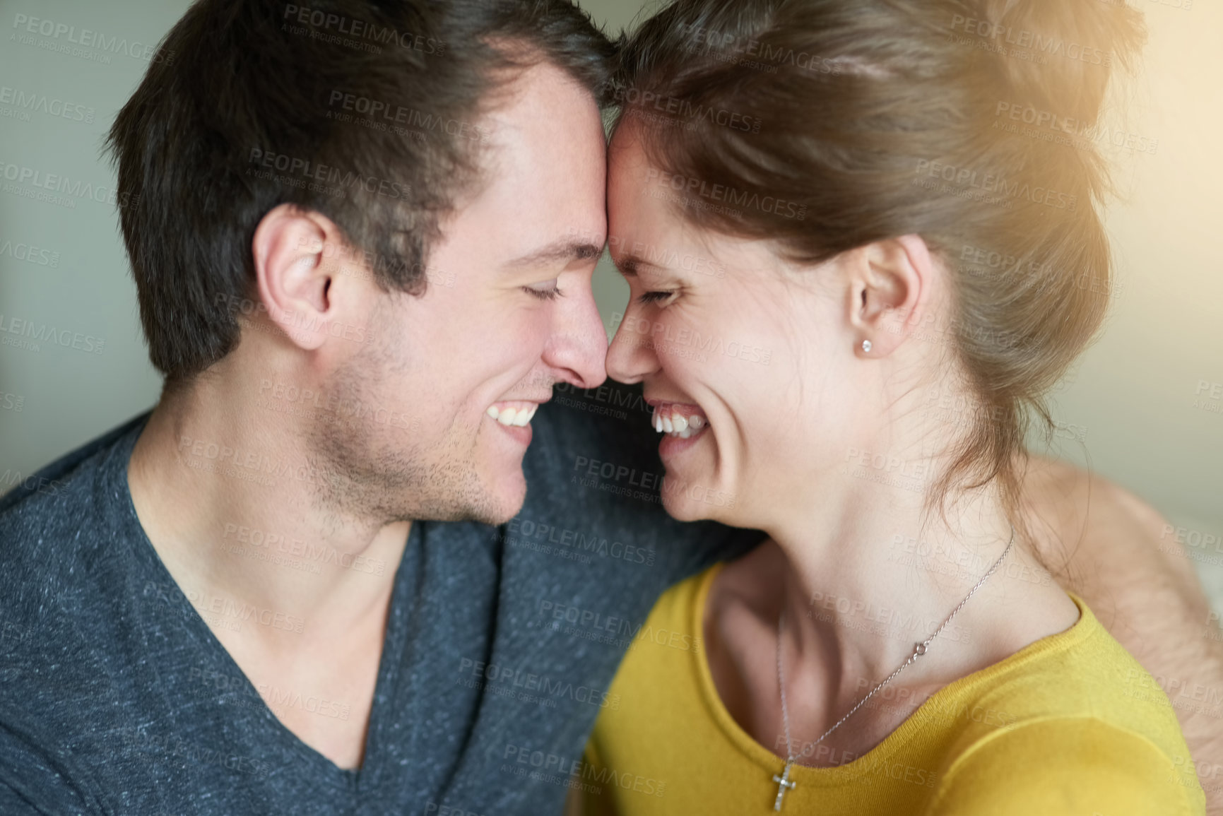 Buy stock photo Shot of a loving couple showing each other affection at home