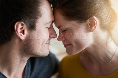 Buy stock photo Face, love or smile and couple closeup in home for bonding, romance or togetherness with flare. Connection, date or happy with forehead touch of man and woman in apartment for support or trust