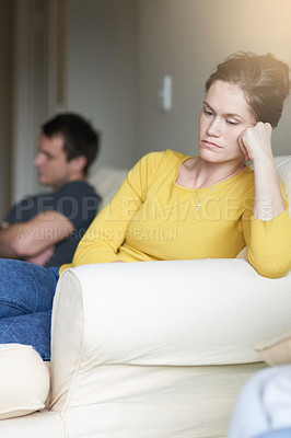 Buy stock photo Stress, marriage and sad couple on sofa in home with anger, argument or fight in living room. Mental health, frustrated woman and man on couch with toxic relationship, divorce or marriage in crisis.