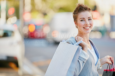 Buy stock photo Portrait of a young businesswoman on a shopping spree in the city