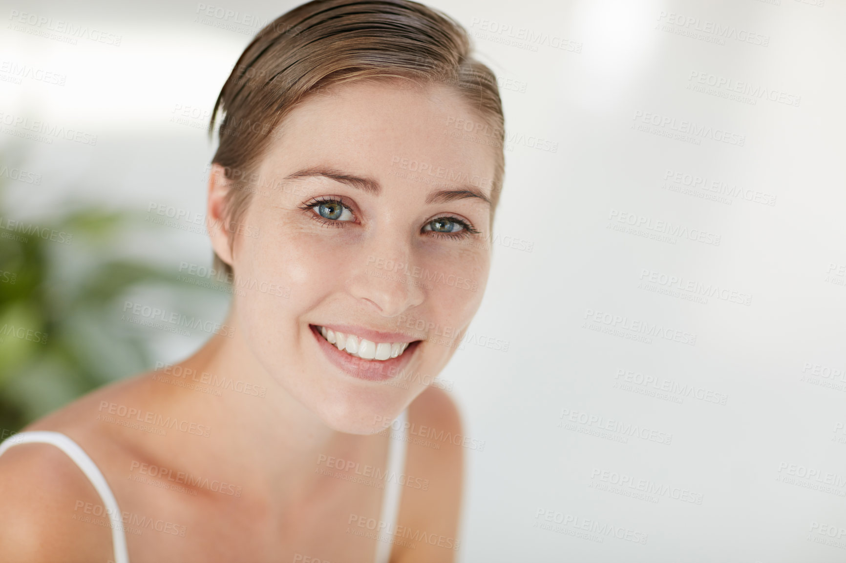 Buy stock photo Portrait of a smiling young woman alone at home