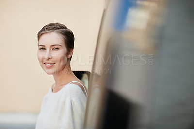 Buy stock photo Portrait of a smiling young woman standing outside