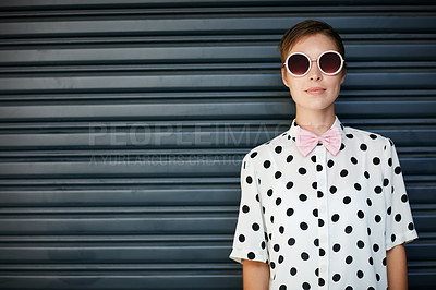 Buy stock photo Portrait of a trendy young woman standing against a corrugated background