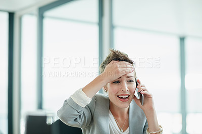 Buy stock photo Cropped shot of a young businesswoman looking anxious while talking on a cellphone in an office