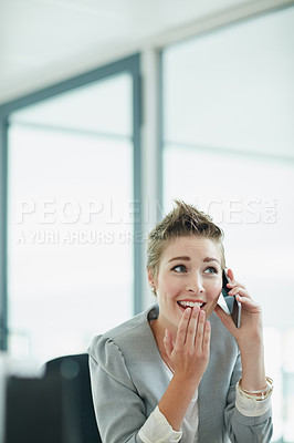 Buy stock photo Cropped shot of a young businesswoman looking surprised while talking on a cellphone in an office