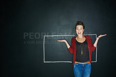 Buy stock photo Studio shot of an expressive young woman posing with a chalk illustration of a box against a dark background