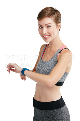 Buy stock photo Studio portrait of a fit young woman checking her watch against a white background