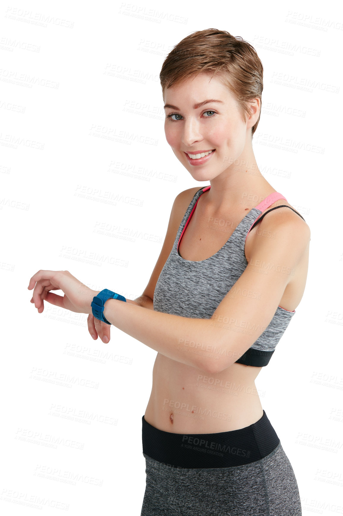 Buy stock photo Studio portrait of a fit young woman checking her watch against a white background