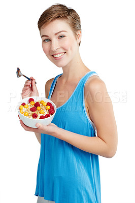 Buy stock photo Breakfast, fruit and portrait of a woman in studio eating snack, meal or craving for nutrition. Happy, smile and young female model enjoying healthy granola for wellness isolated by white background.