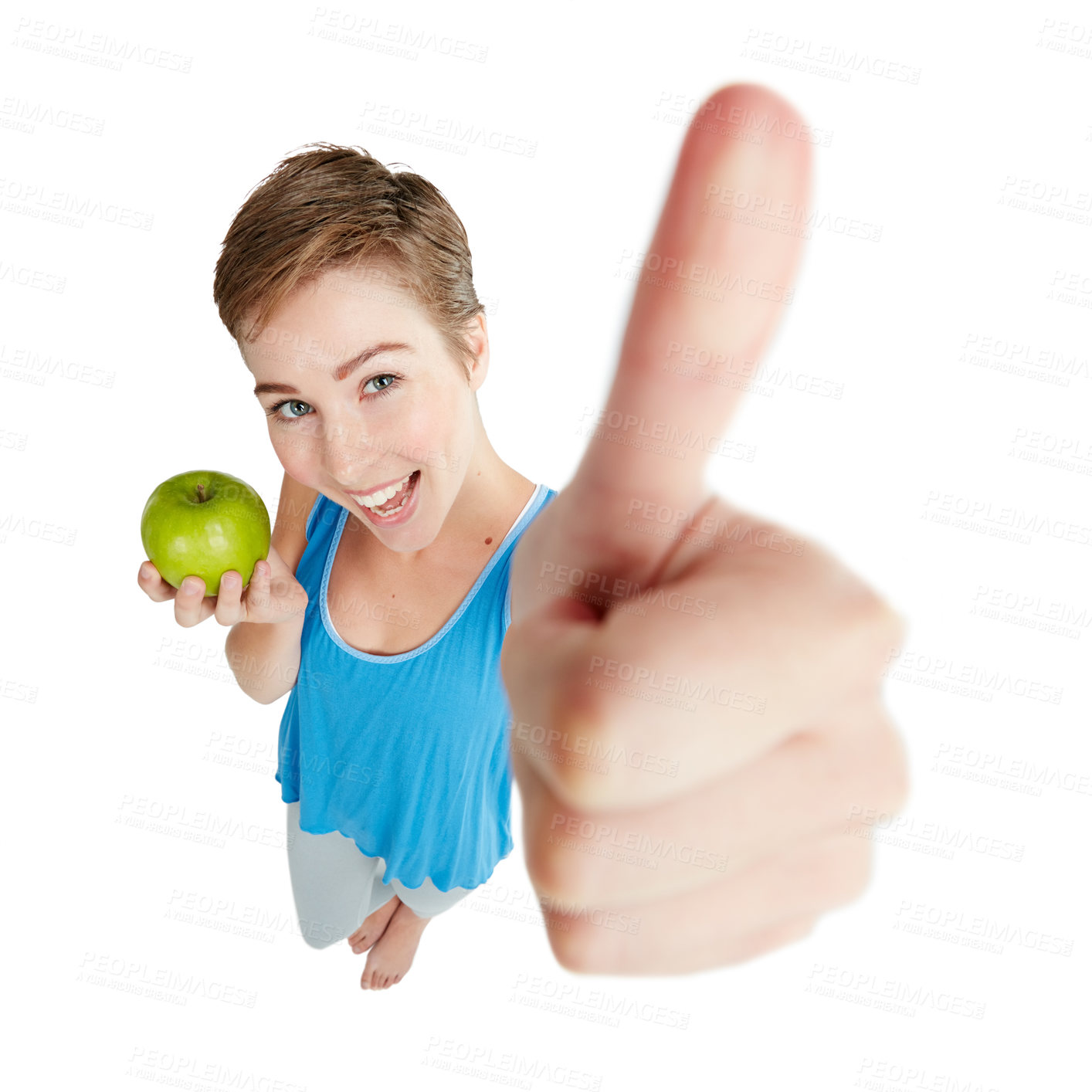 Buy stock photo Portrait, apple and thumbs up with a woman in studio isolated on a white background for health from above. Yes, diet and hand sign with a young female posing to promote nutrition or weightloss