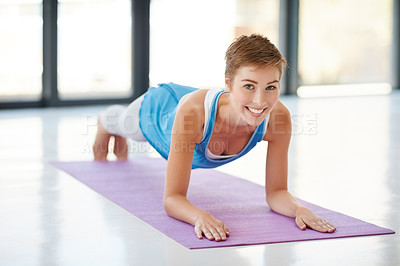 Buy stock photo Woman, portrait smile and plank on yoga mat for healthy fitness, strong core or zen workout indoors. Happy female yogi stretching for abdominal muscle training, balance or wellness exercise at a gym