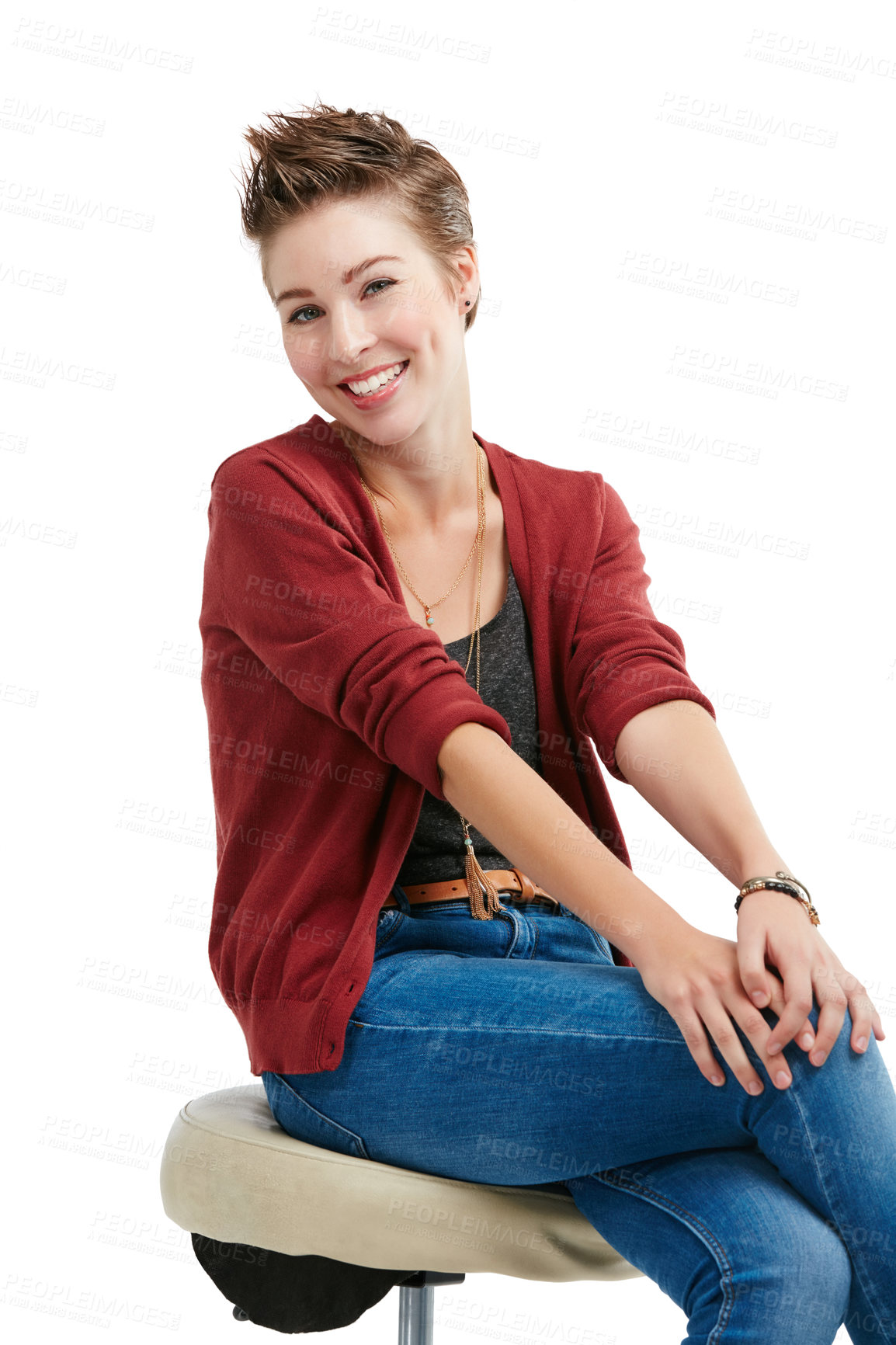 Buy stock photo Studio portrait of a happy young woman sitting on a chair against a white background