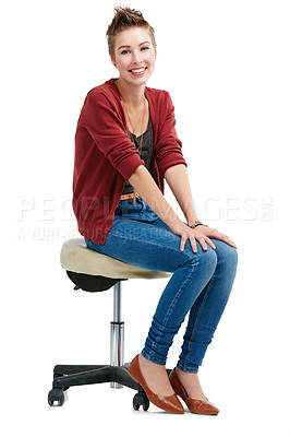 Buy stock photo Studio portrait of a happy young woman sitting on a chair against a white background