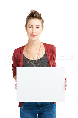 Buy stock photo Studio portrait of a young woman holding a blank placard against a white background