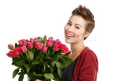 Buy stock photo Studio portrait of a happy young woman holding a bouquet of flowers against a white background