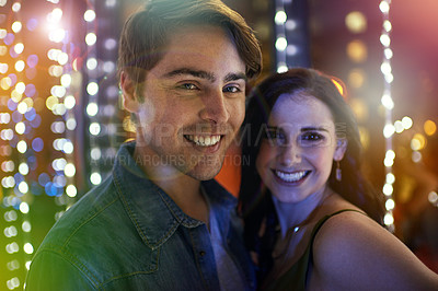 Buy stock photo Portrait of a young couple enjoying themselves at a nightclub