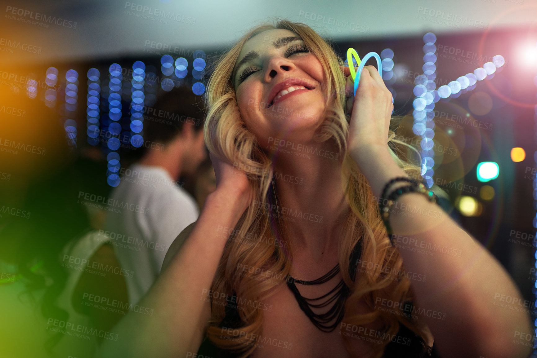 Buy stock photo Dance, lights and woman in neon nightclub for fun, music or happy weekend at social event. Nightlife, energy and girl at trendy rave club with flare, smile and celebration at party with youth culture