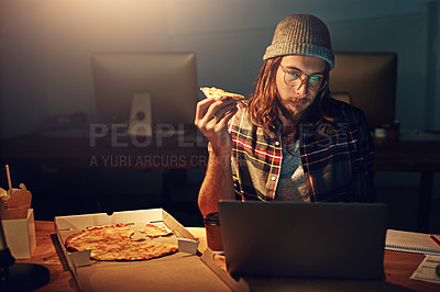 Buy stock photo Web designer, man with pizza at laptop and night shift, overtime and deadline at digital marketing agency. Content research, reading and serious male at desk, working late at startup eating fast food