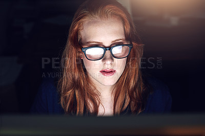 Buy stock photo Shot of a young businesswoman working late in her office