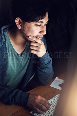 Buy stock photo Web designer, Asian man at desk and thinking during night shift, overtime and deadline at digital marketing agency. Content research, reading and serious male, working late at startup and typing