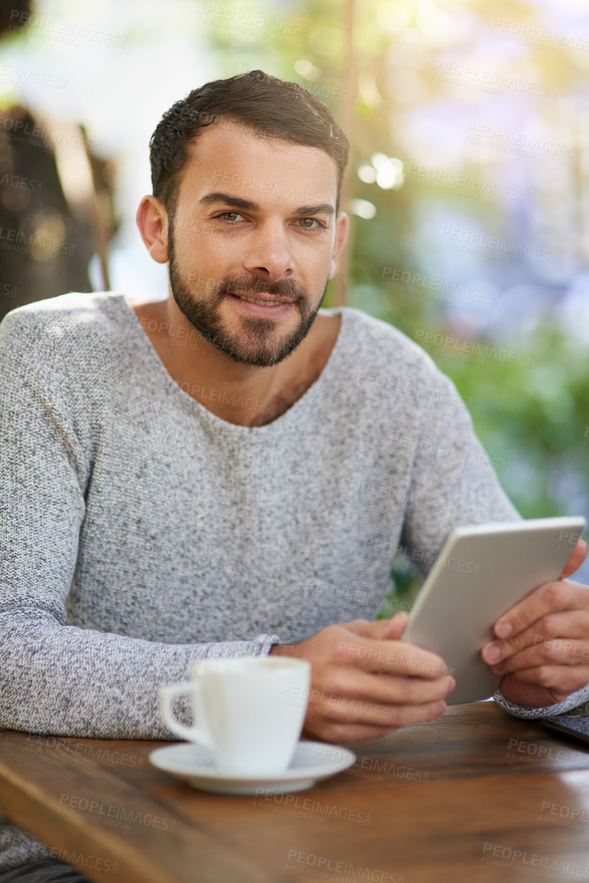 Buy stock photo Man, tablet and portrait in cafe with relax, social media app and internet connection for reading online news. Male person, smile and tech in restaurant with coffee, research and lens flare in Brazil