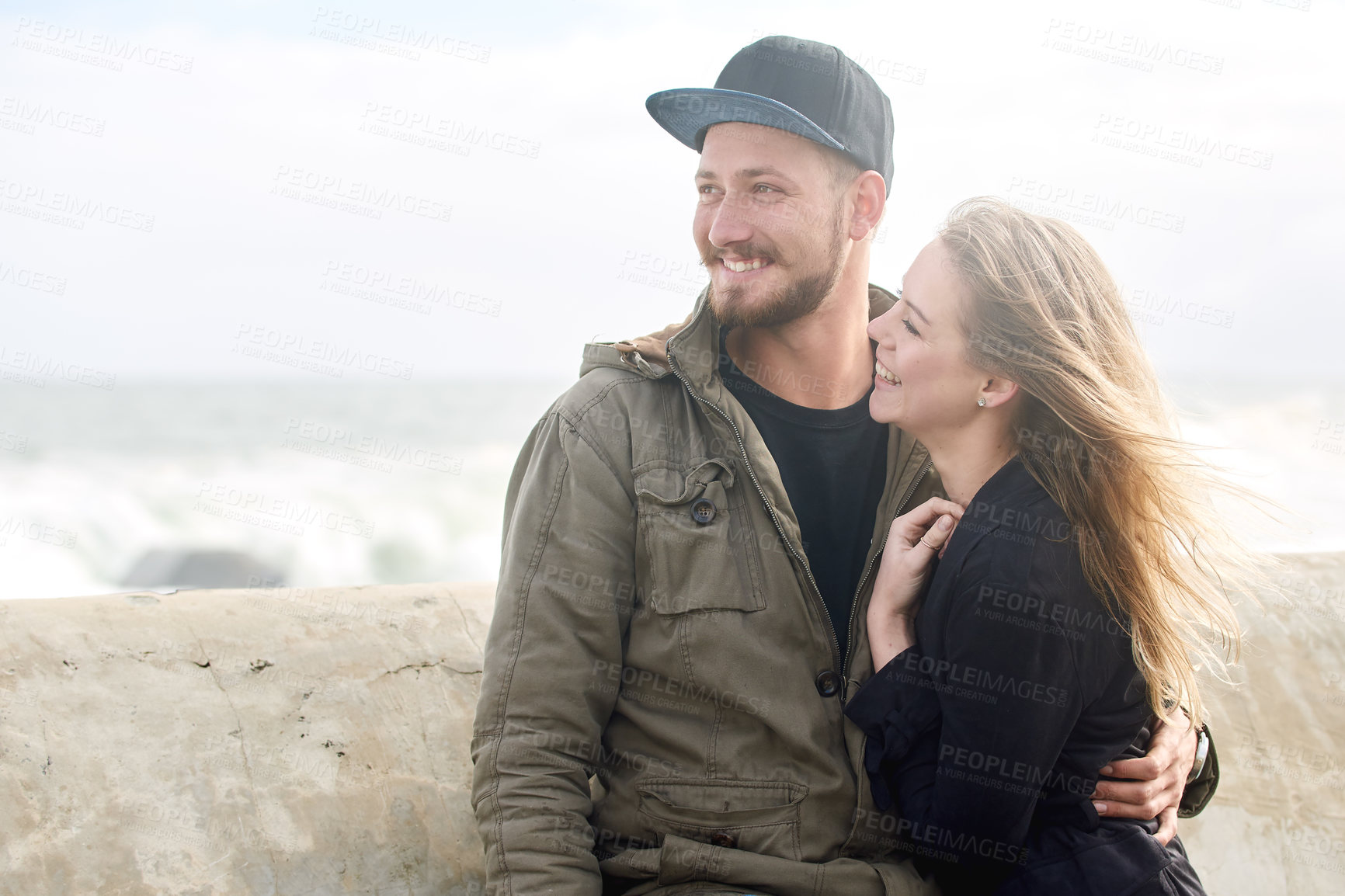 Buy stock photo Shot of an affectionate young couple spending time together outdoors