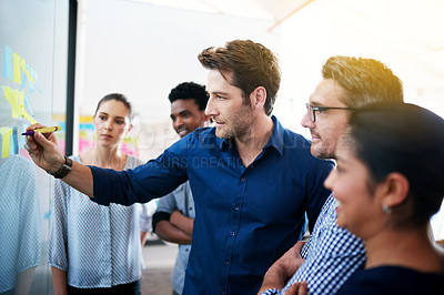 Buy stock photo Shot of a group of colleagues having a meeting in the boardroom 