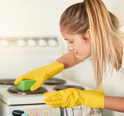 Buy stock photo Woman, kitchen and cleaning stove in home for hygiene, housework or housekeeping service for safety. Chores, cooker and maid with sponge to scrub dirt, dust and bacteria on electrical appliance oven
