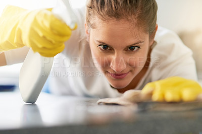 Buy stock photo Woman, kitchen counter and cleaning bottle in house for hygiene, housework and housekeeping service for safety. Chores, spray and maid with cloth on table to wipe dirt, dust and bacteria in home