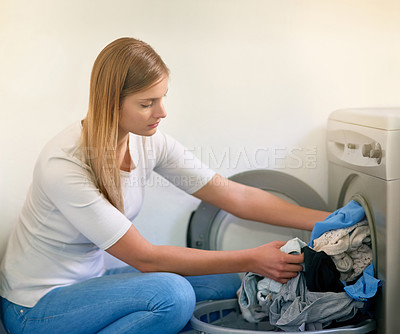 Buy stock photo Woman, laundry and washing machine for cleaning in home, dirty clothes and routine housework. Female person, linen and fabric maintenance in apartment, sanitary and maid for hygiene housekeeping