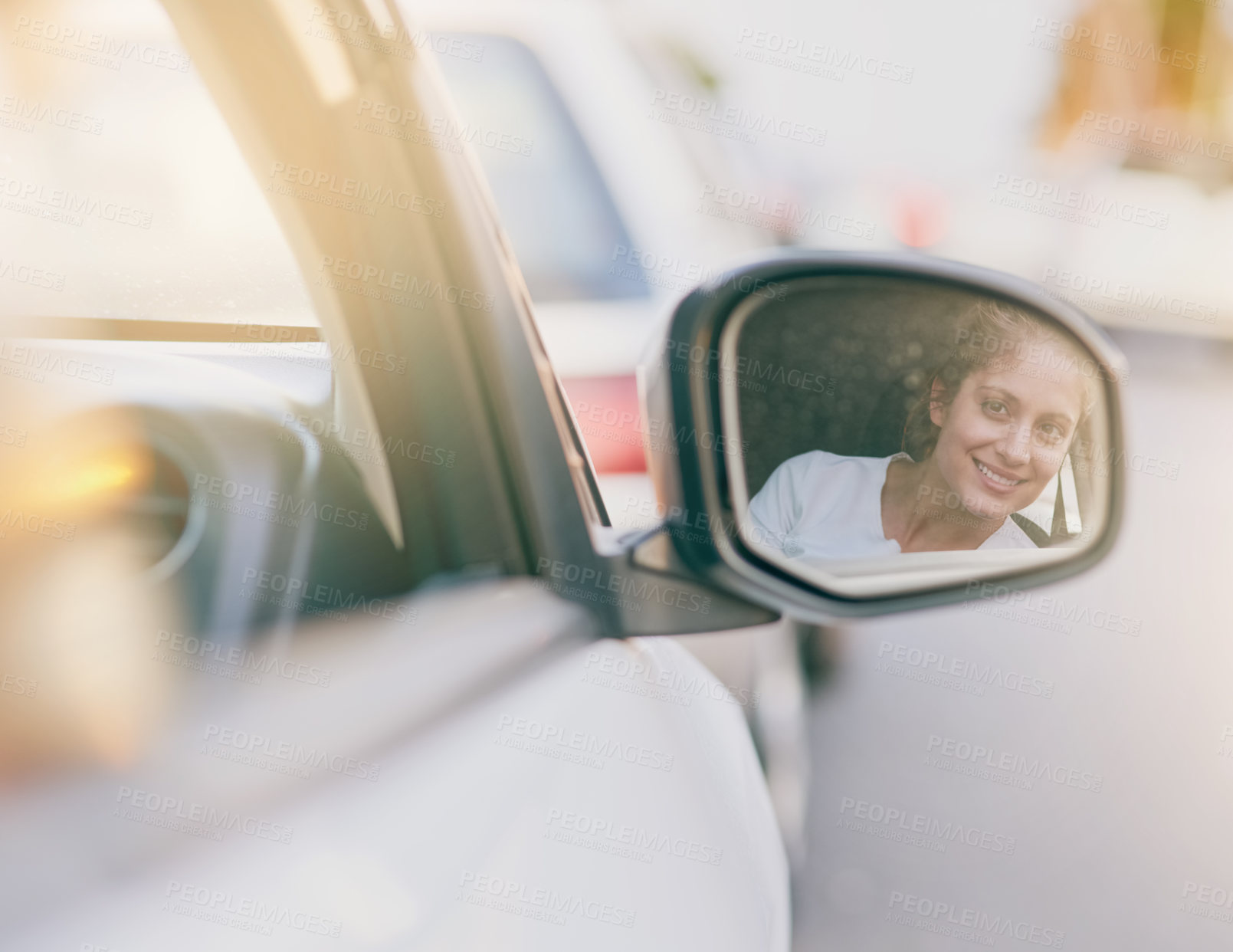 Buy stock photo Young, woman and driving with side mirror in car for road trip, travel or commute for holiday. Female person, check and reflection in glass for safety on vacation, smile or happiness for journey