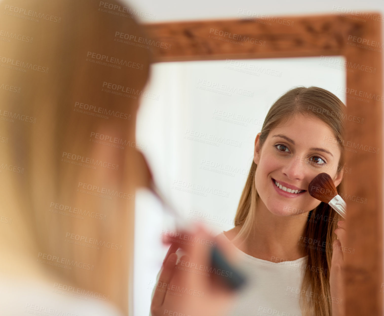 Buy stock photo Woman, home and smile on mirror with makeup brush for beauty, reflection and satisfied with results. Female person, face and happy with foundation or powder for aesthetics and confident on skin