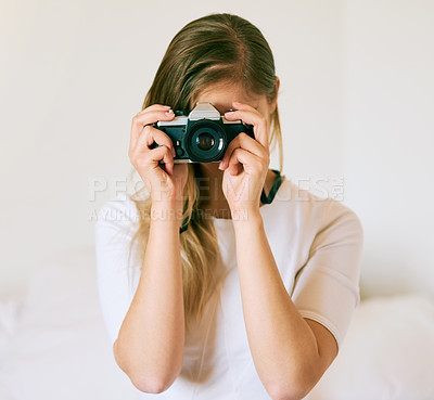 Buy stock photo Camera, woman and photography in living room for hobby, capture memory or photoshoot. Lens, creativity and female student with vintage equipment for journalism, media or artistic expression in home
