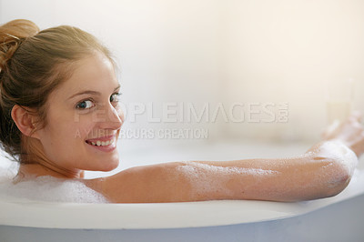 Buy stock photo Portrait of a beautiful young woman relaxing in the bathtub