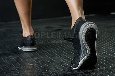 Buy stock photo Studio shot of an unrecognizable woman's feet during her workout against a dark background