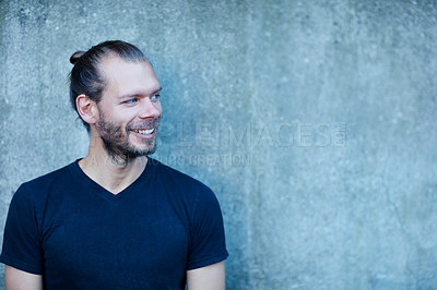 Buy stock photo Portrait of a man leaning against a wall outside