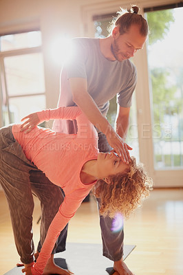 Buy stock photo Shot of a young physical therapist working with his female patient