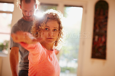 Buy stock photo Shot of a young physical therapist working with his female patient
