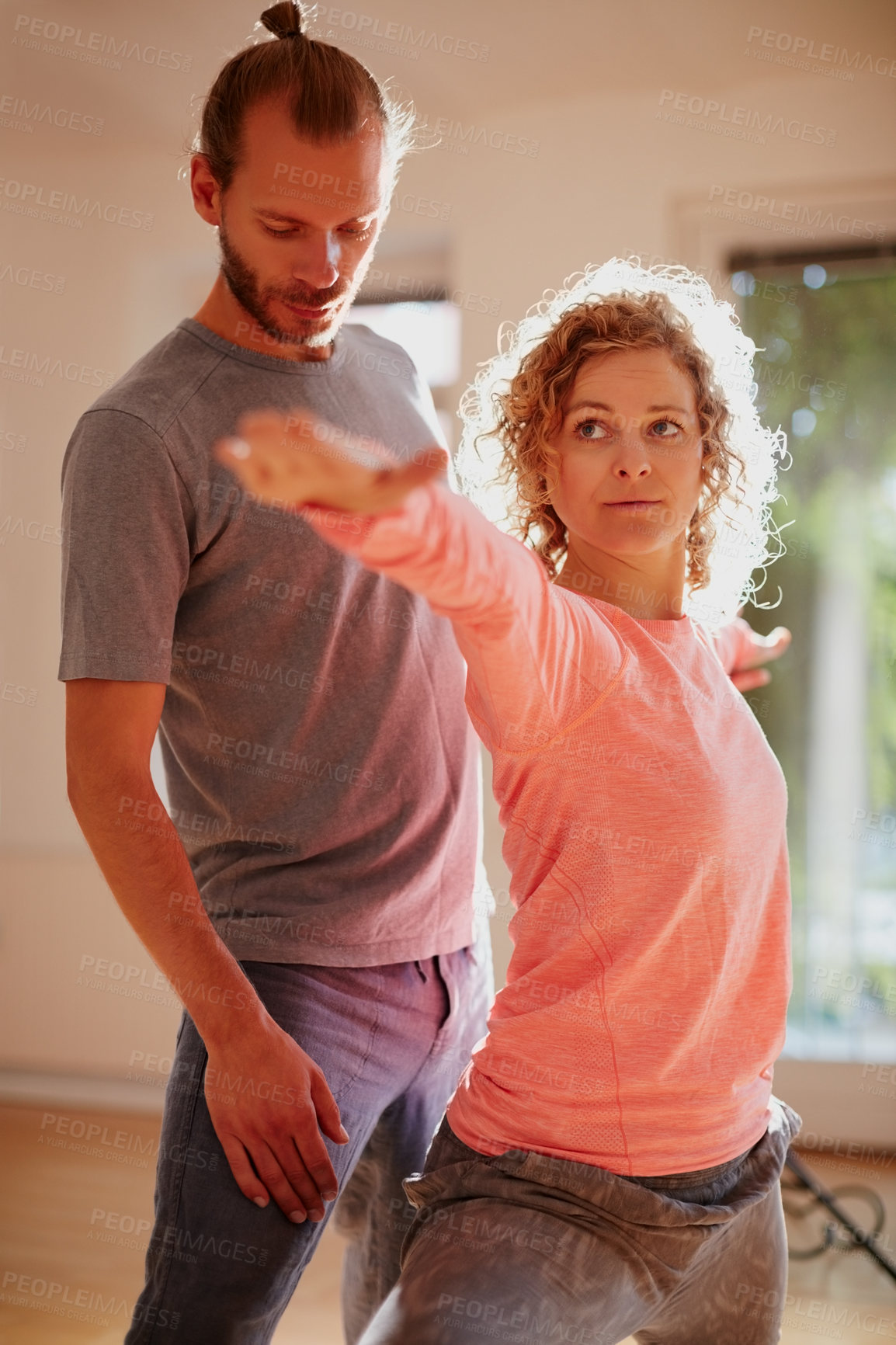 Buy stock photo Shot of a young physical therapist working with his female patient